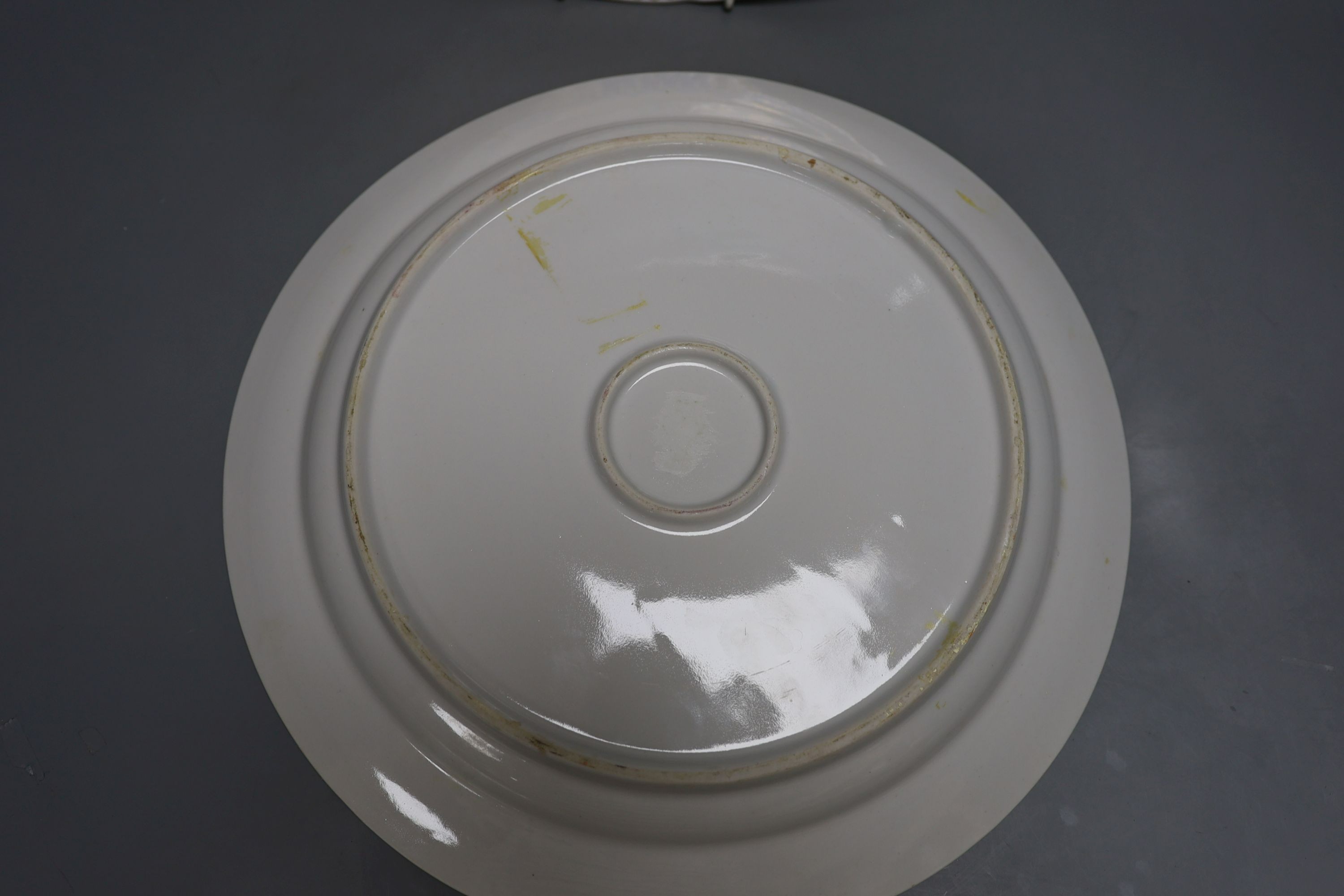 A pair of Russian porcelain dishes, painted by Malysheva and dated 1992, 35cm diameter
